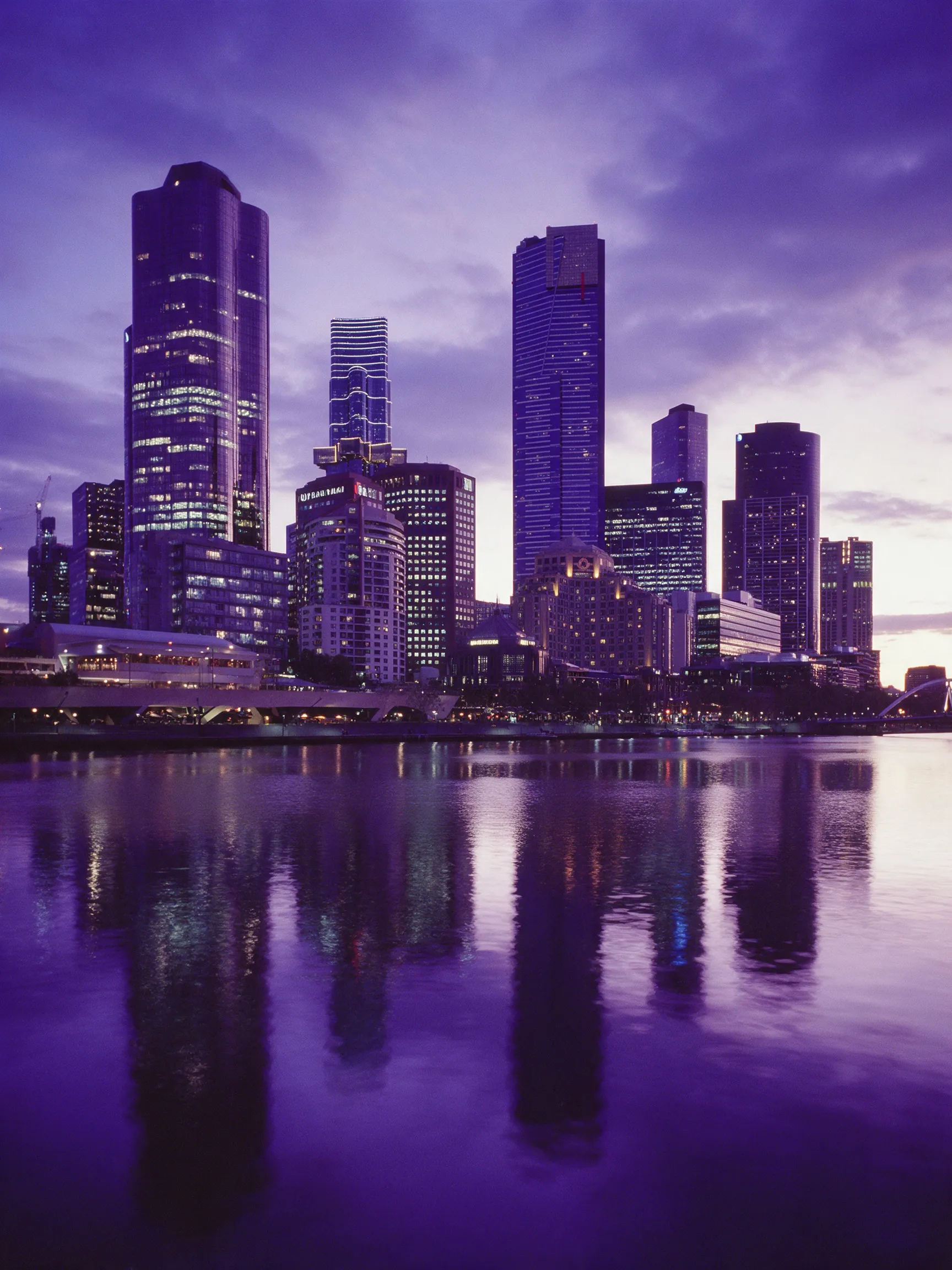 Melbourne city skyline across the Yarra River at dusk