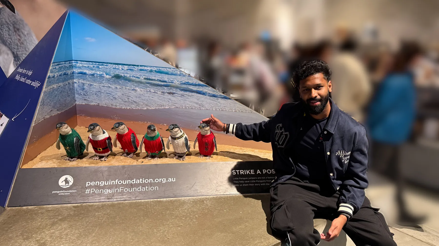 Sam Lingaraju smiling and pointing